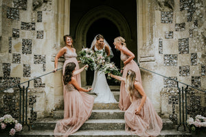 Bride and her Bridesmaids enjoying their flower bouquets